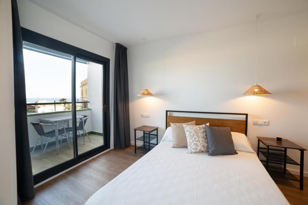 Postel nebo postele na pokoji v ubytování Apartaments Voralmar