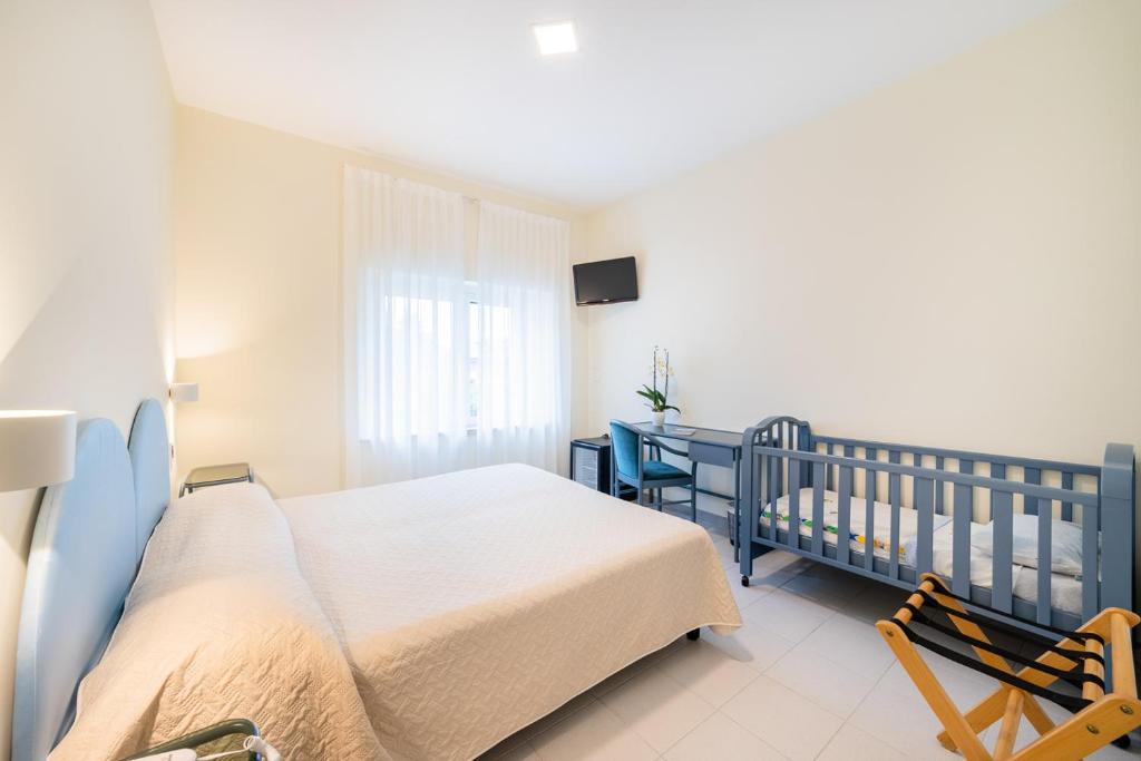 Postel nebo postele na pokoji v ubytování Hotel Il Gabbiano