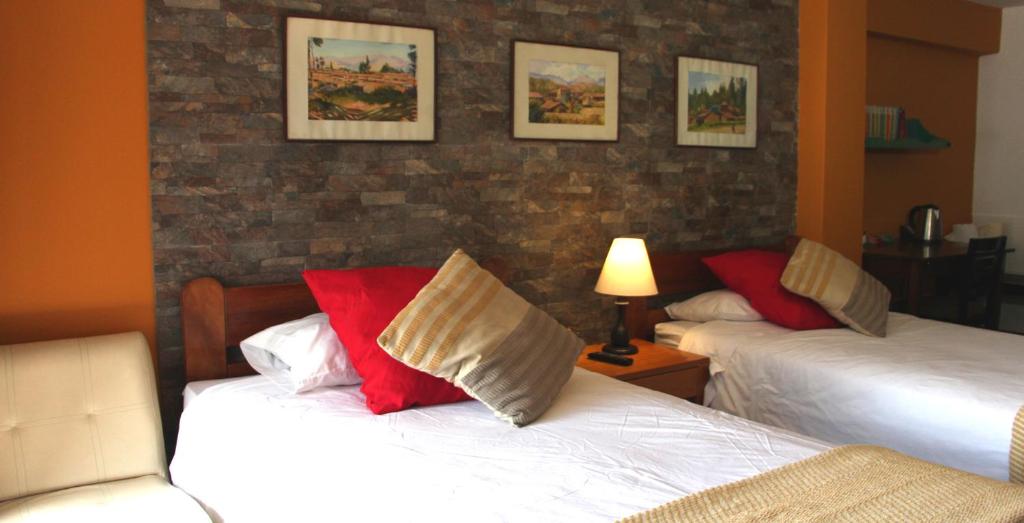 Postel nebo postele na pokoji v ubytování Hotel Churup