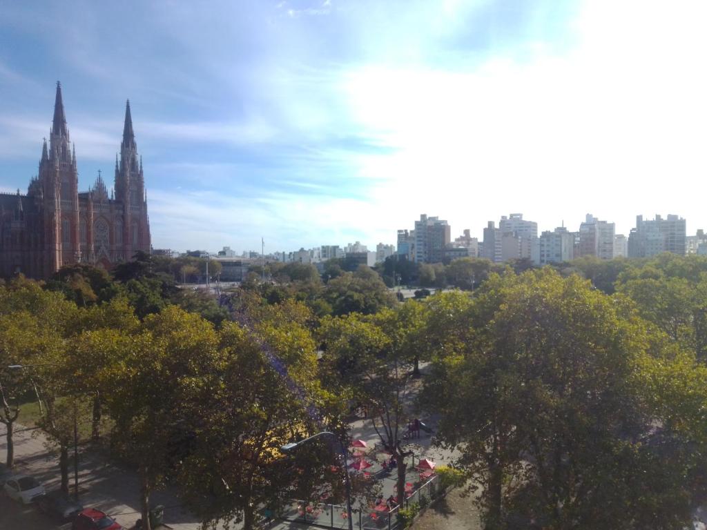 a view of a city skyline with trees and buildings at Depto Plaza Moreno in La Plata