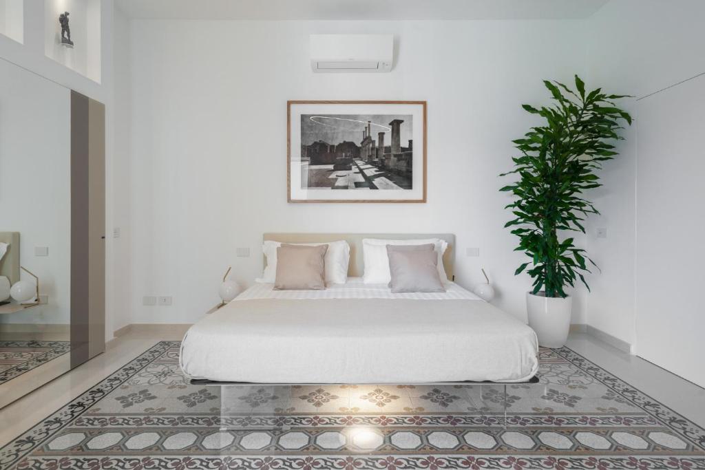 Postel nebo postele na pokoji v ubytování Sopramonte Exclusive Rooms