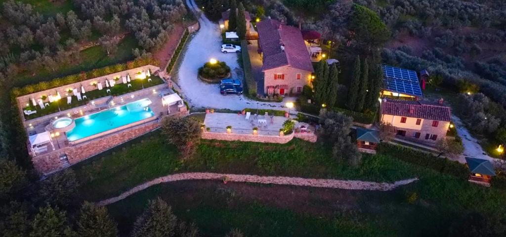 an aerial view of a house with a swimming pool at Borgo dei Gigli in Lamporecchio