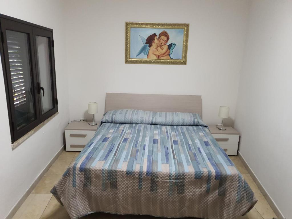 Postel nebo postele na pokoji v ubytování Nel Cuore di Campomarino