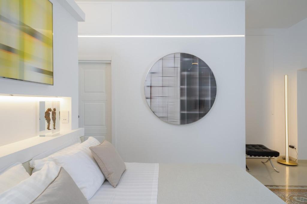 Postel nebo postele na pokoji v ubytování Sopramonte Exclusive Rooms