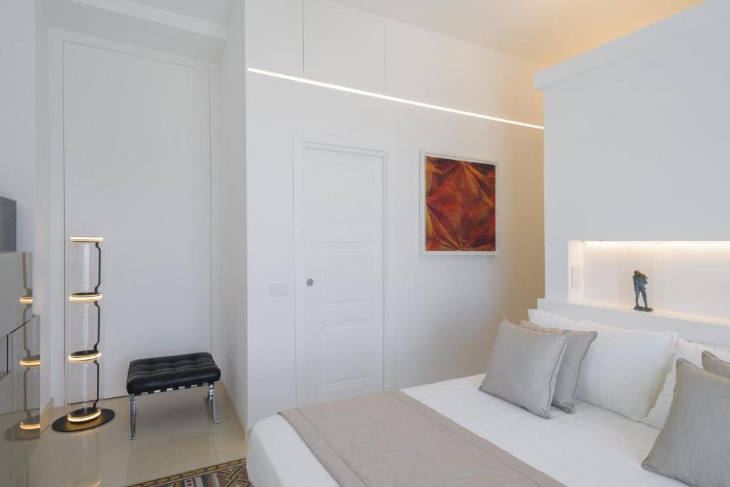 Postel nebo postele na pokoji v ubytování Sopramonte Exclusive Rooms