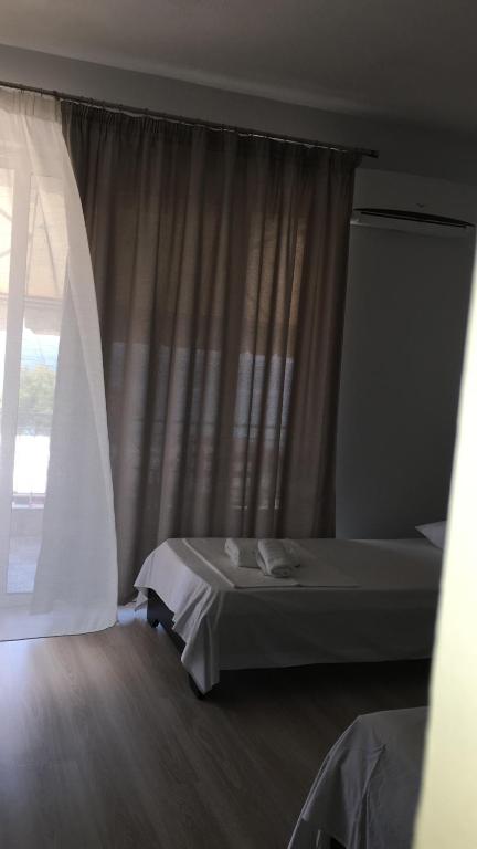 Postel nebo postele na pokoji v ubytování IRINI boutique rooms!!!