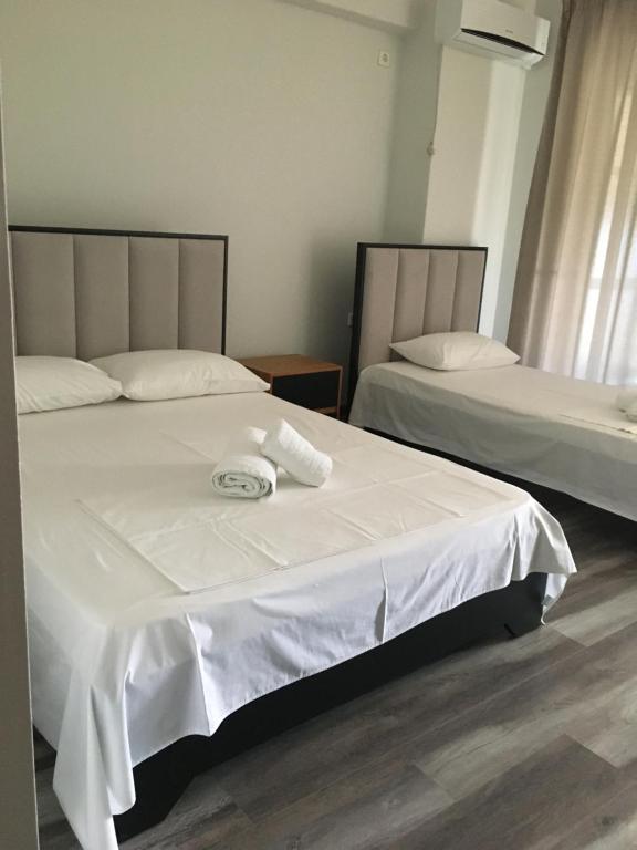 Postel nebo postele na pokoji v ubytování IRINI boutique rooms!!!
