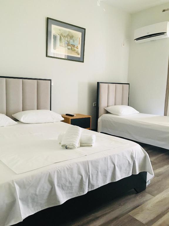 Postel nebo postele na pokoji v ubytování IRINI boutique rooms!!!