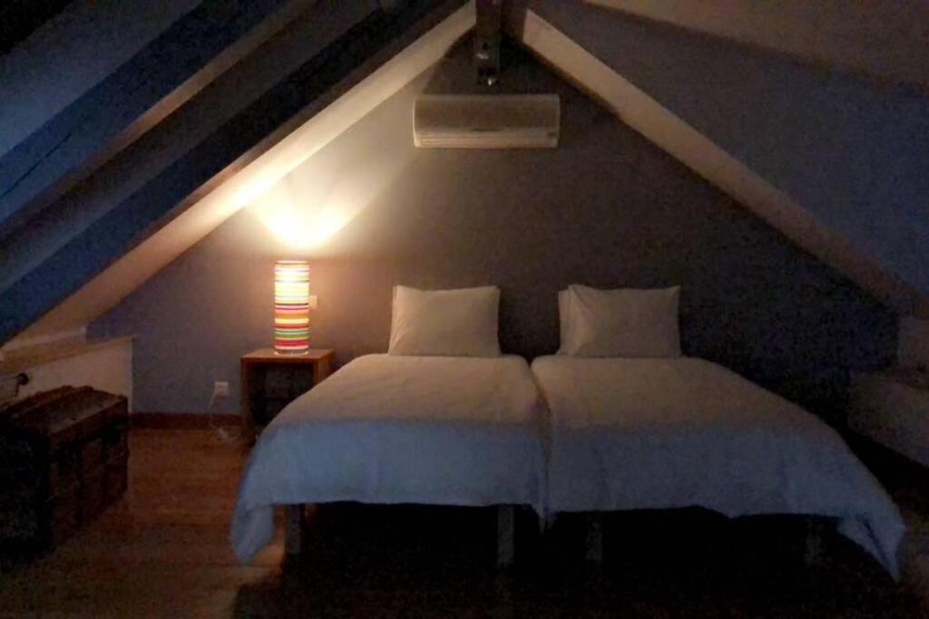 Postel nebo postele na pokoji v ubytování Le petit haut de Meuse