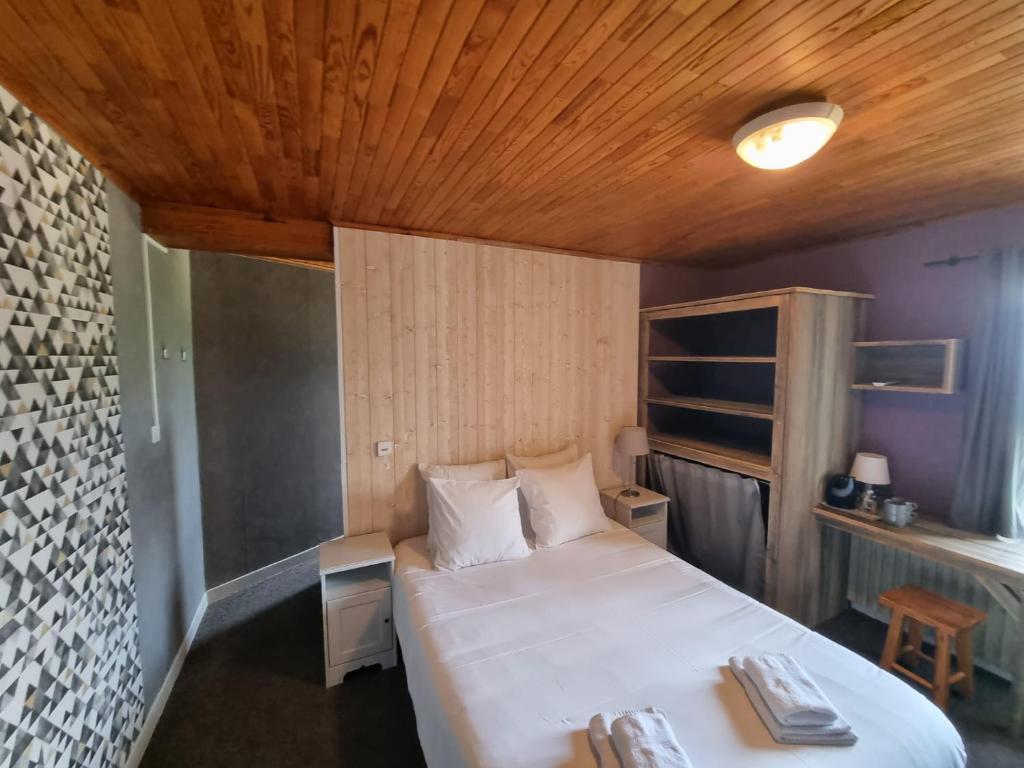 Postel nebo postele na pokoji v ubytování Hotel Le Beau Site