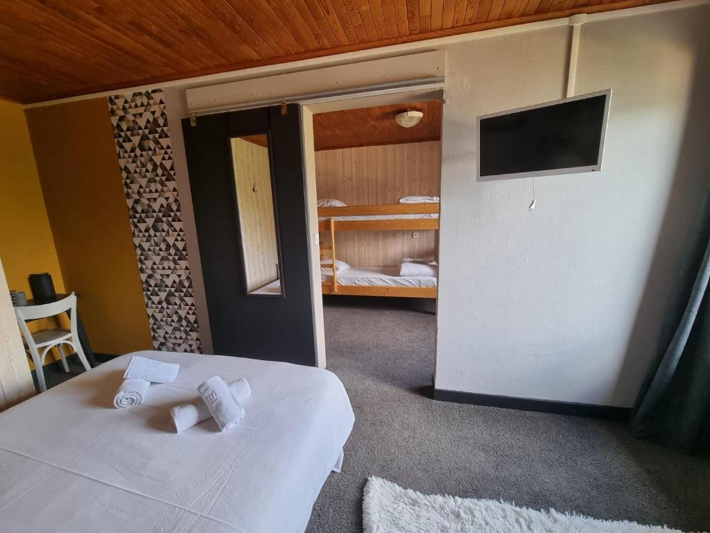 Postel nebo postele na pokoji v ubytování Hotel Le Beau Site
