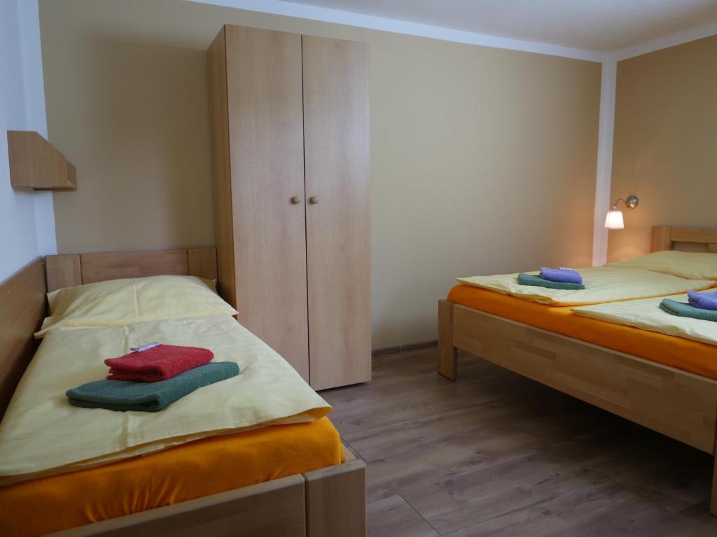 Postel nebo postele na pokoji v ubytování Pension Aspen Harrachov