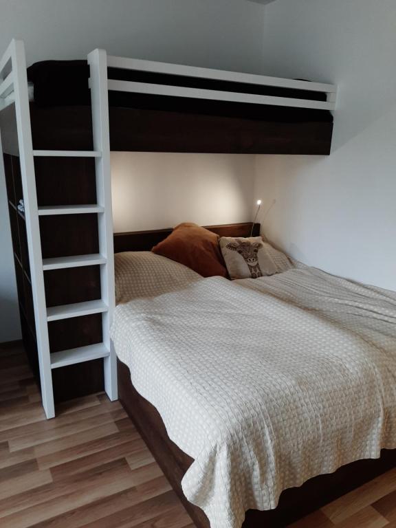 Postel nebo postele na pokoji v ubytování Apartmán Studnice
