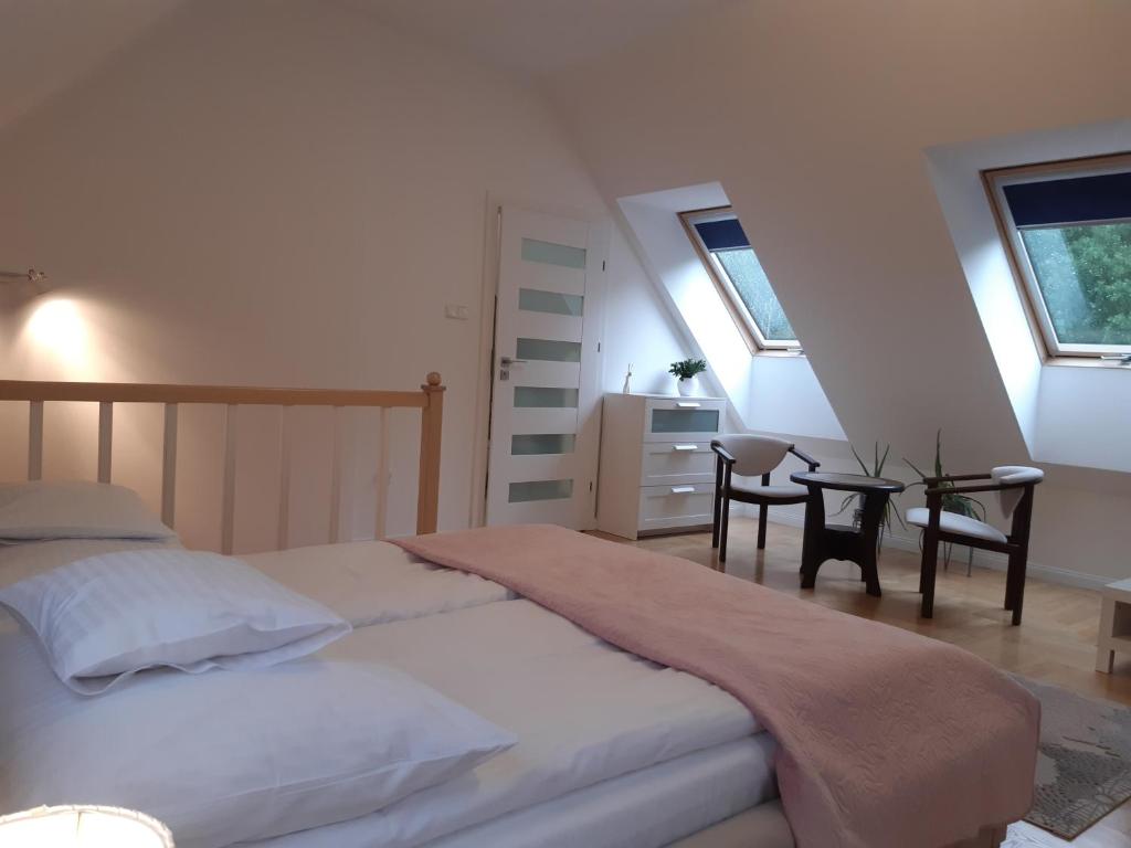 Posteľ alebo postele v izbe v ubytovaní Apartamenty przy Stoku Mrągowo