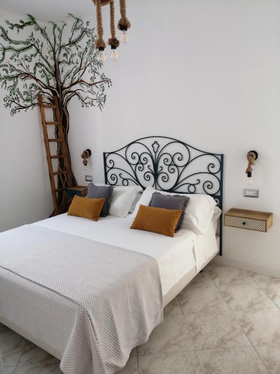 Postel nebo postele na pokoji v ubytování B&B Mario Relais
