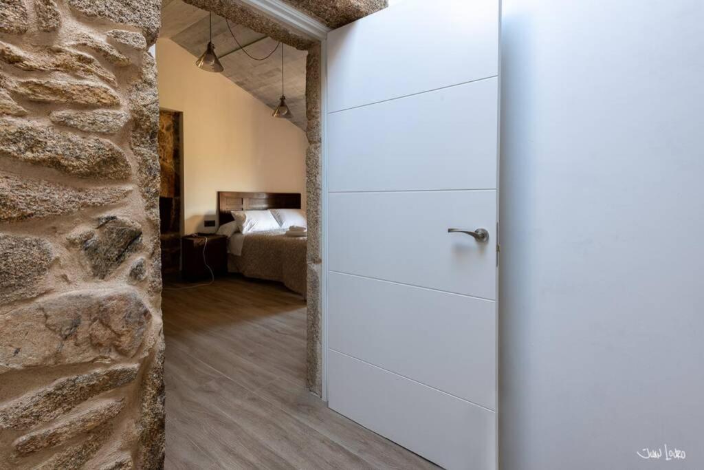A bed or beds in a room at O AGOCHO DA MOA