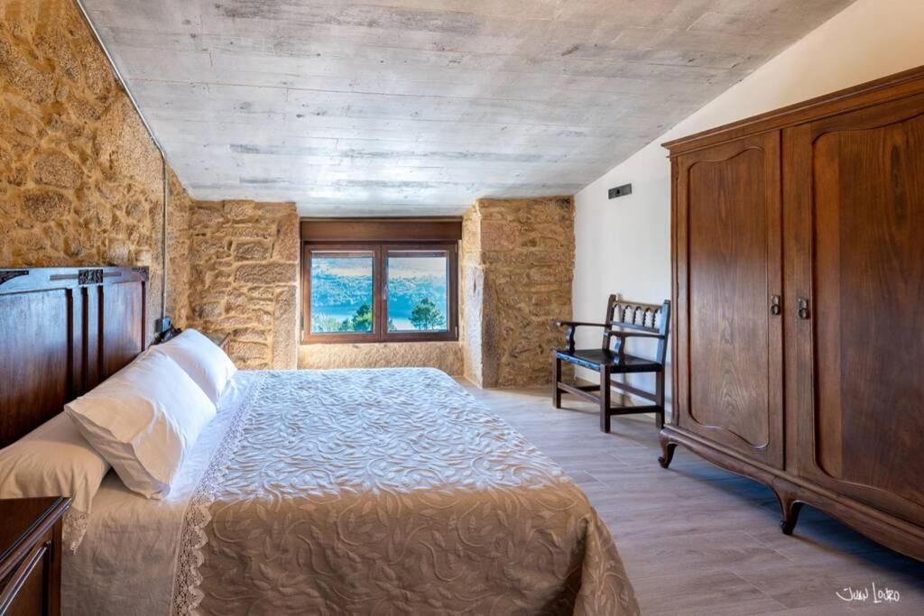 A bed or beds in a room at O AGOCHO DA MOA