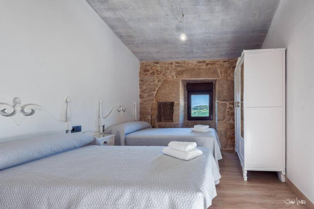 A bed or beds in a room at O AGOCHO DA MOA
