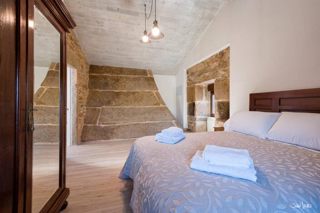 A bed or beds in a room at O AGOCHO DA MOA