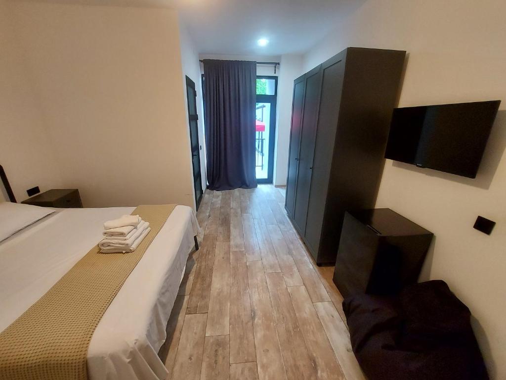Postel nebo postele na pokoji v ubytování Level Up Hotel & Restaurant