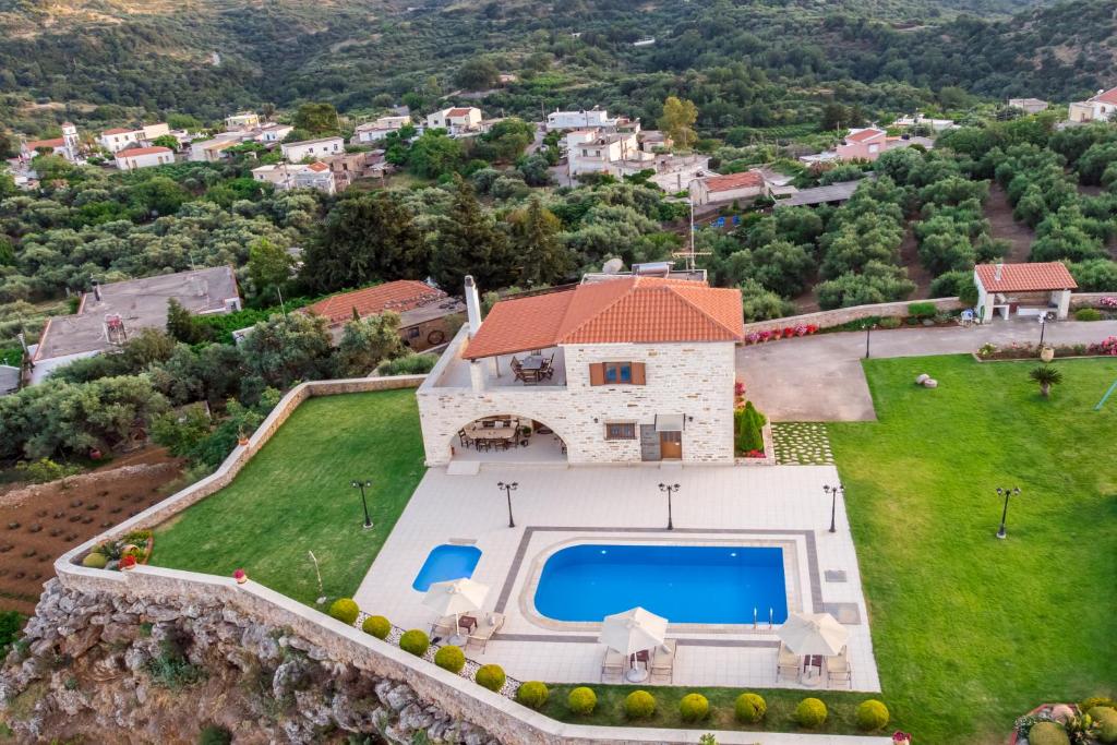 an aerial view of a house with a swimming pool at Ktima Edem in Ramní