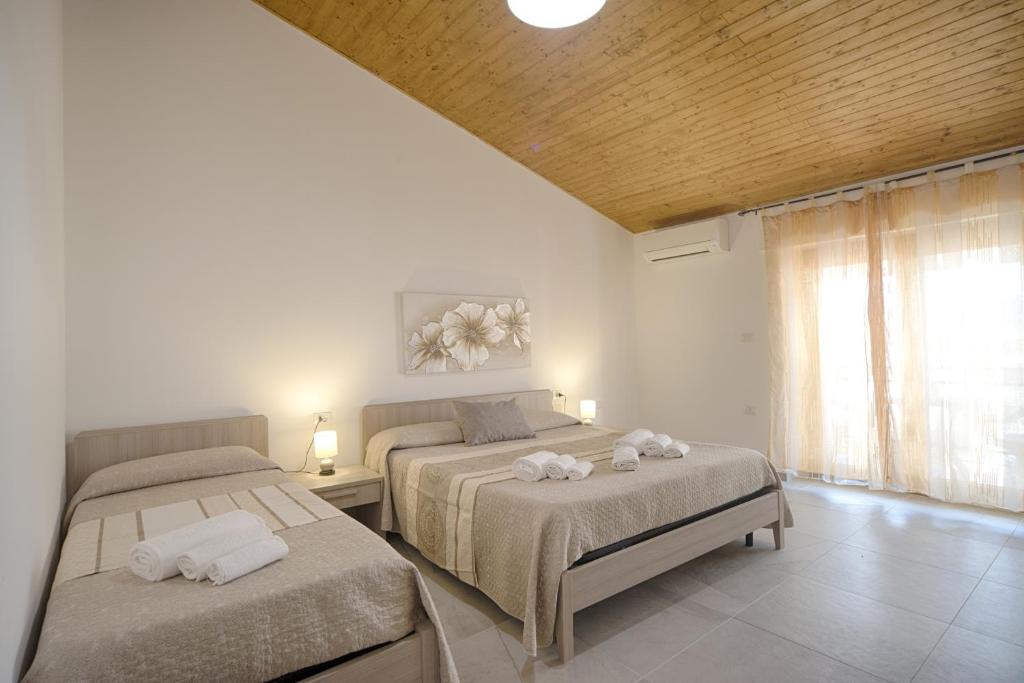 Postel nebo postele na pokoji v ubytování Casa Lucia