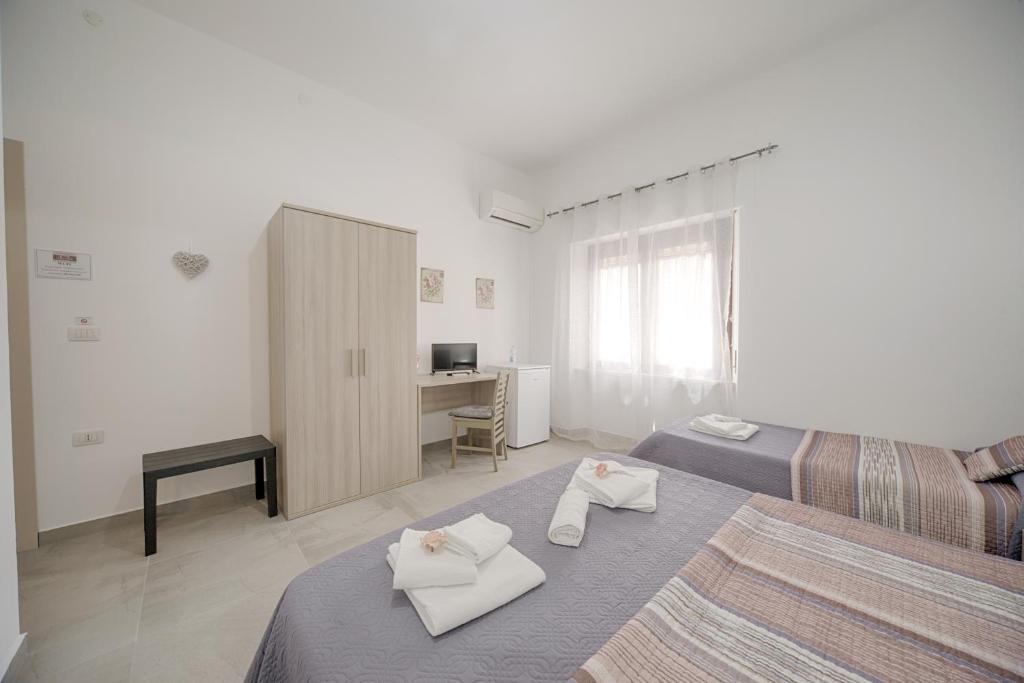 Postel nebo postele na pokoji v ubytování Casa Lucia