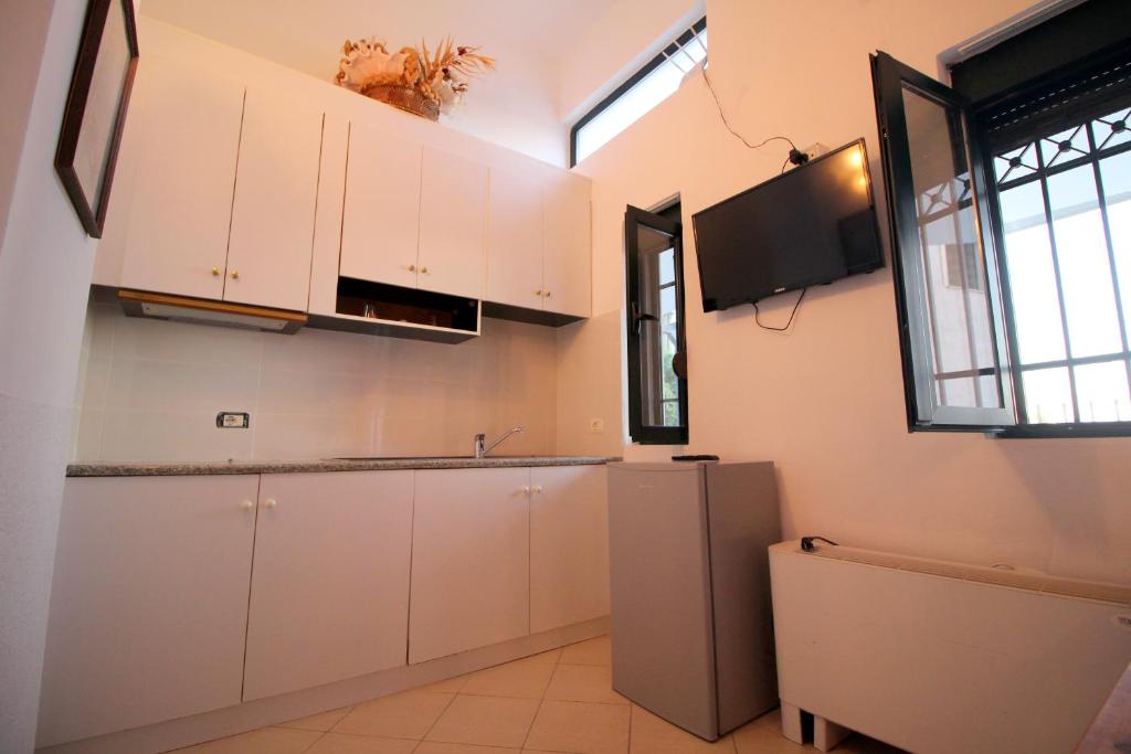 Kuchyň nebo kuchyňský kout v ubytování Olympia Hotel