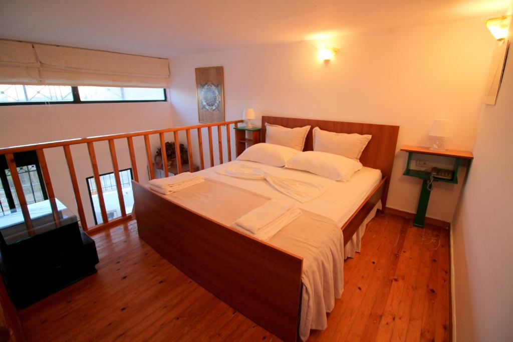 Postel nebo postele na pokoji v ubytování Olympia Hotel