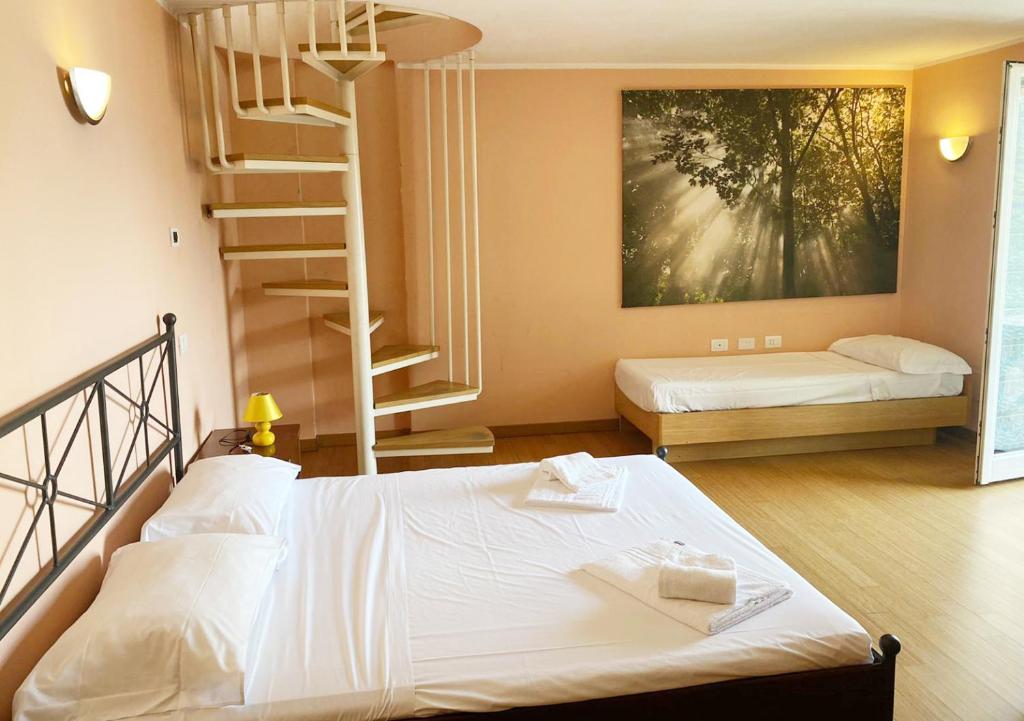 Cama o camas de una habitación en Appartamenti vista lago