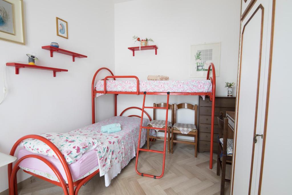 Łóżko lub łóżka w pokoju w obiekcie Casa vacanze Podere Bellavista