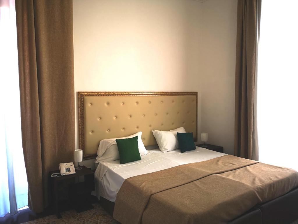Postel nebo postele na pokoji v ubytování Hotel Valentino