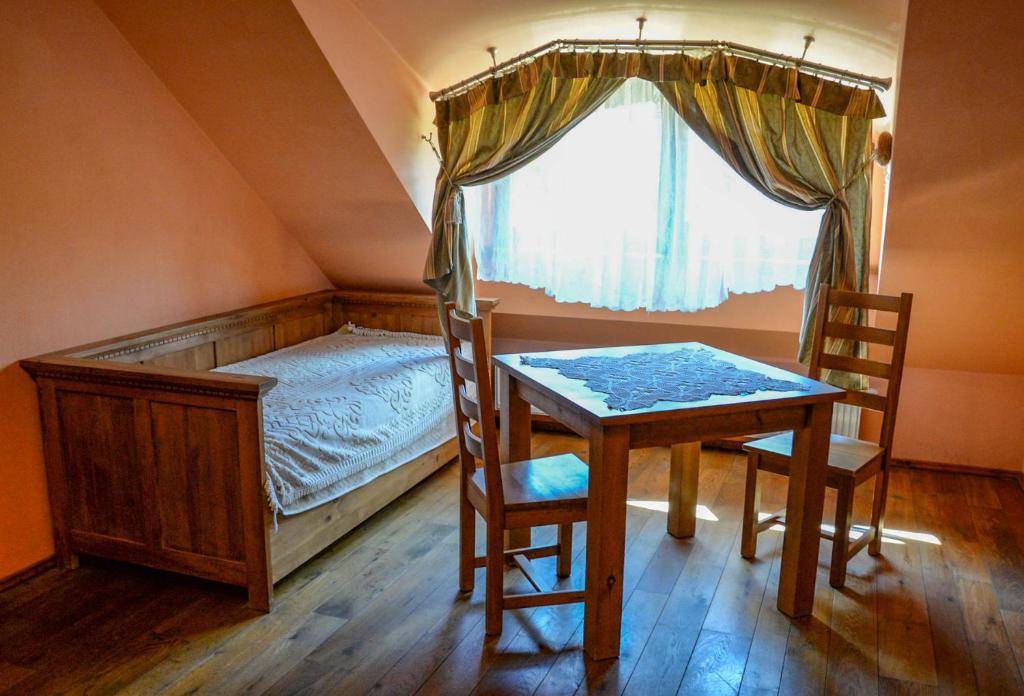 Posteľ alebo postele v izbe v ubytovaní Karczma Regionalna Hotel GOŚCINNA CHATA