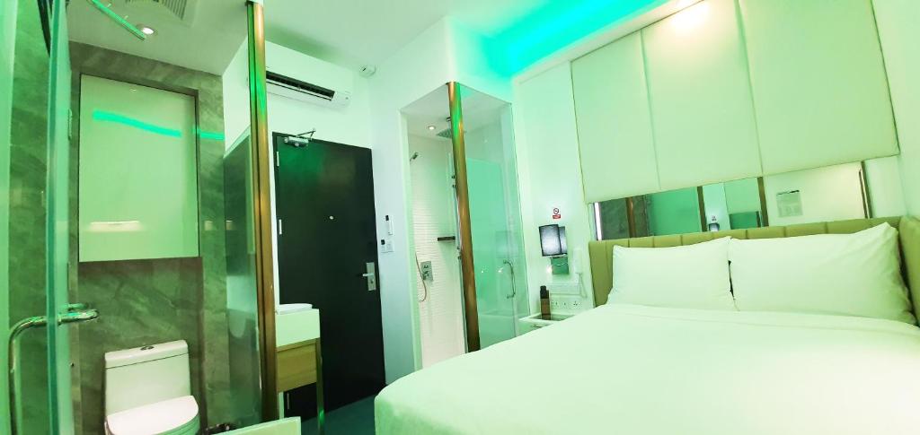 Postel nebo postele na pokoji v ubytování iOtel Luxury Kiosk Hotel