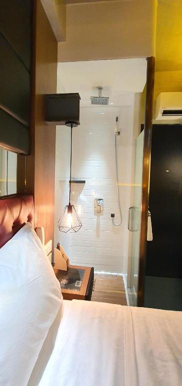 Postel nebo postele na pokoji v ubytování iOtel Luxury Kiosk Hotel