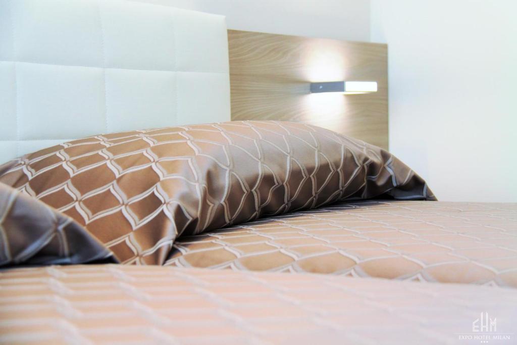 Postel nebo postele na pokoji v ubytování Expo Hotel Milan