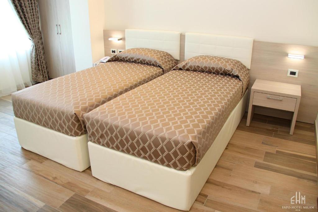 Postel nebo postele na pokoji v ubytování Expo Hotel Milan
