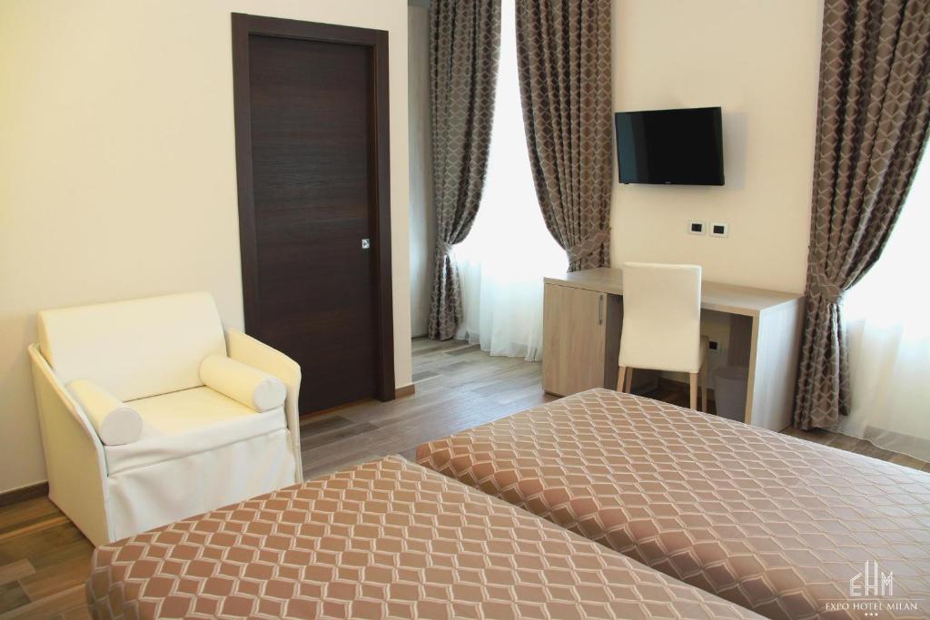 Postel nebo postele na pokoji v ubytování Expo Hotel Milan