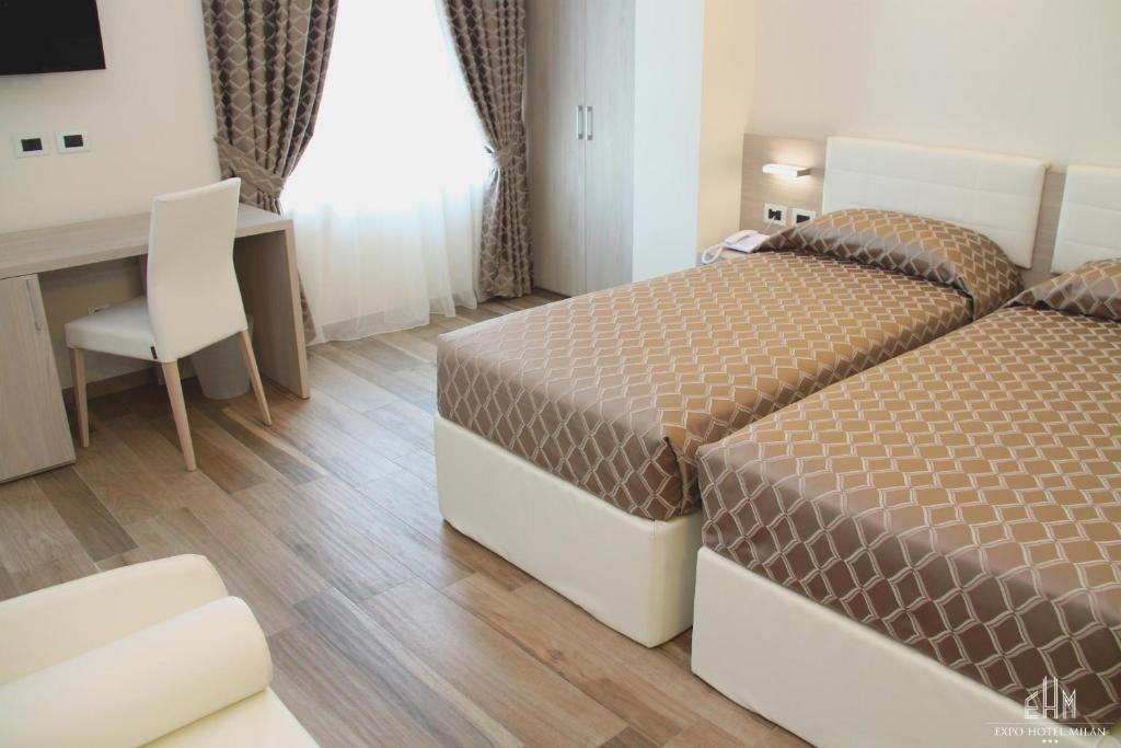 Postel nebo postele na pokoji v ubytování Expo Hotel Milan