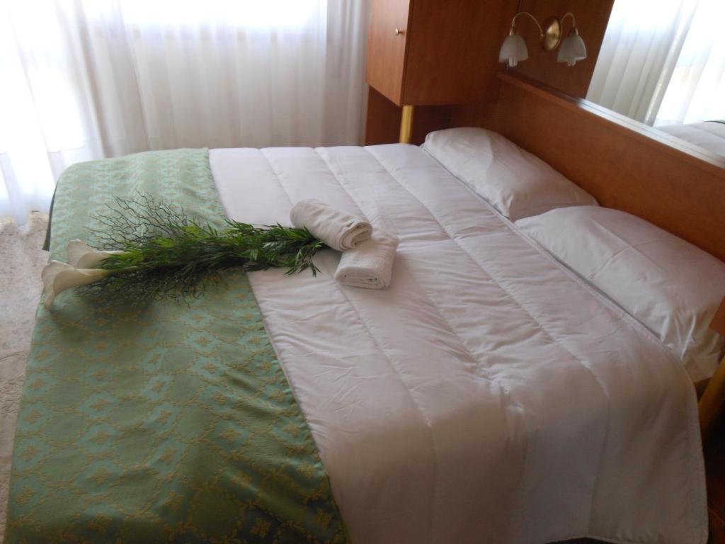 Postel nebo postele na pokoji v ubytování Oasi Verde