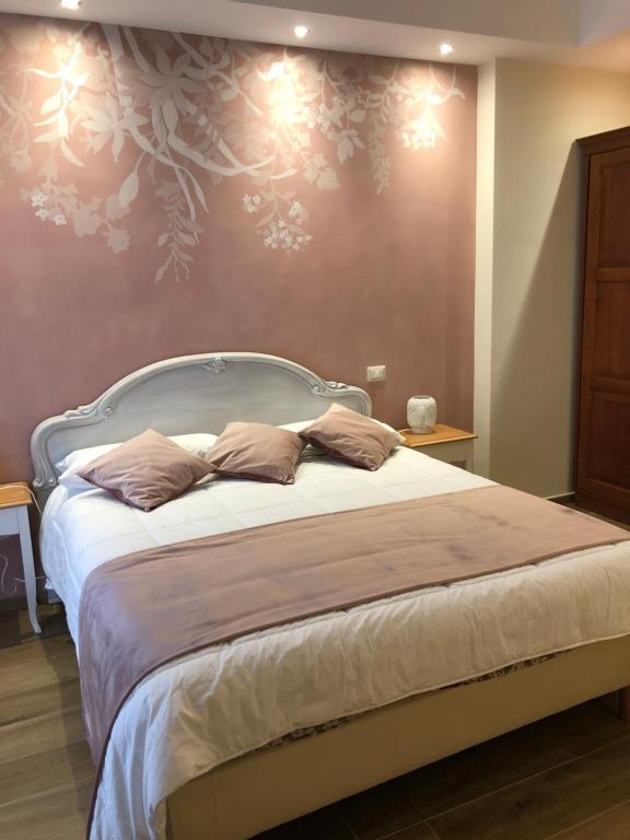 Postel nebo postele na pokoji v ubytování CAVALIERE suite & rooms