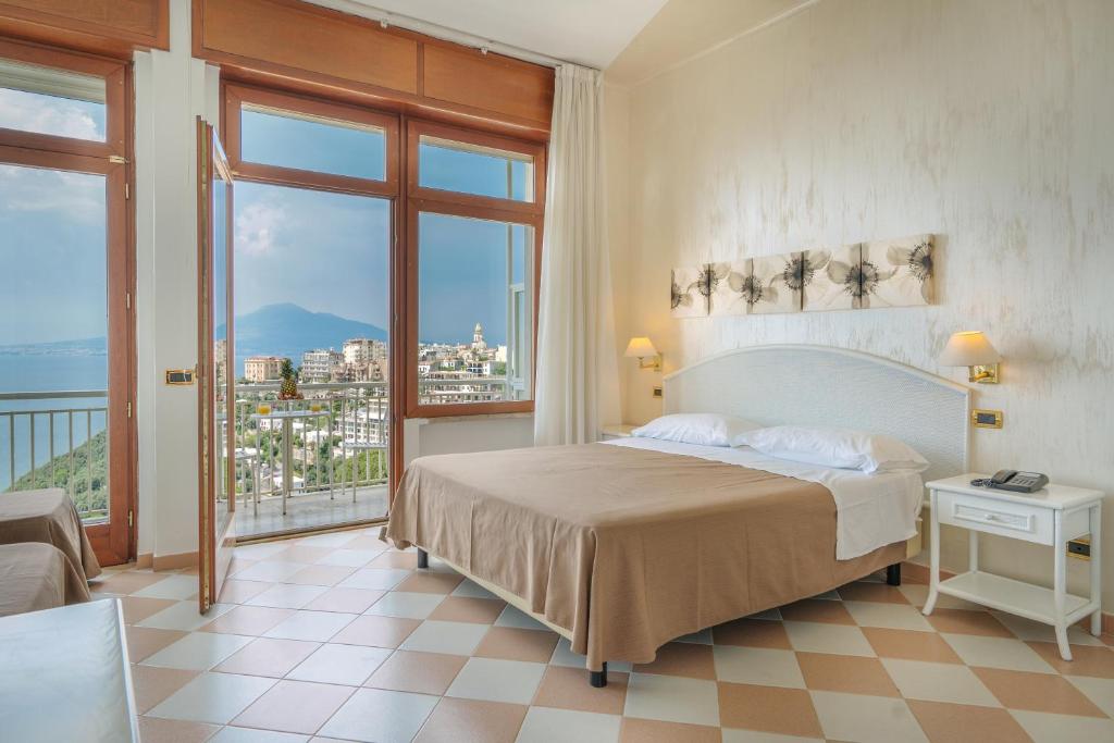 Postel nebo postele na pokoji v ubytování Grand Hotel Moon Valley