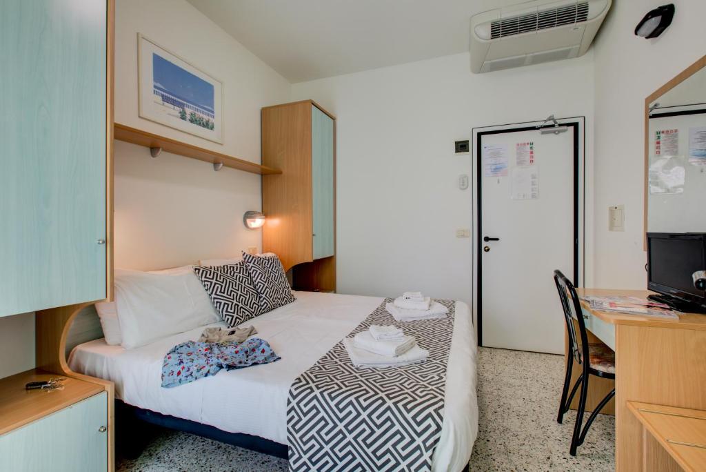 Postel nebo postele na pokoji v ubytování Hotel Christian Ideale Per Famiglie