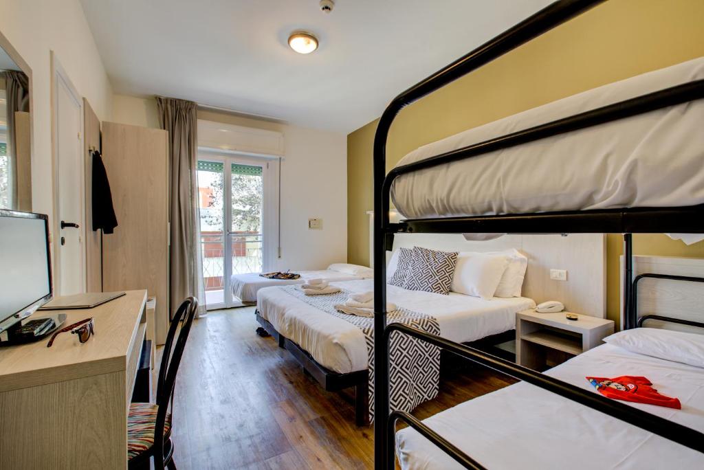 Postel nebo postele na pokoji v ubytování Hotel Christian Ideale Per Famiglie