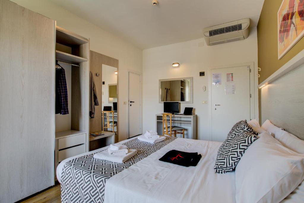 Postel nebo postele na pokoji v ubytování Hotel Christian Ideale Per Famiglie