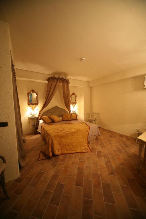 Postel nebo postele na pokoji v ubytování Il Poggio Country Resort