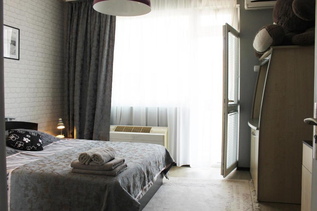 Postel nebo postele na pokoji v ubytování Sunny Day Apartment