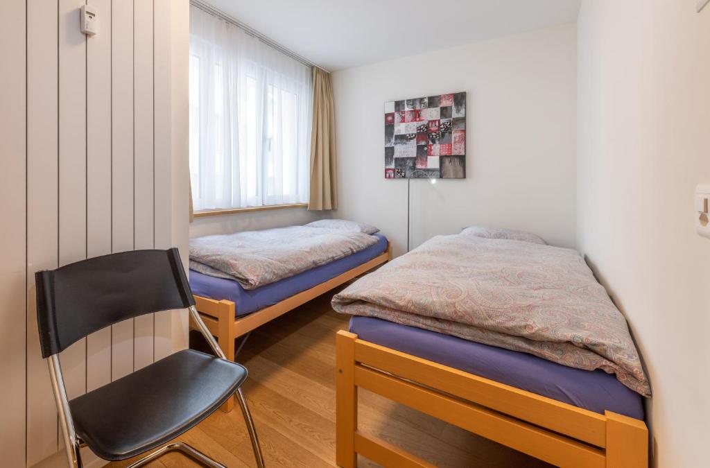Postel nebo postele na pokoji v ubytování Haus Darioli