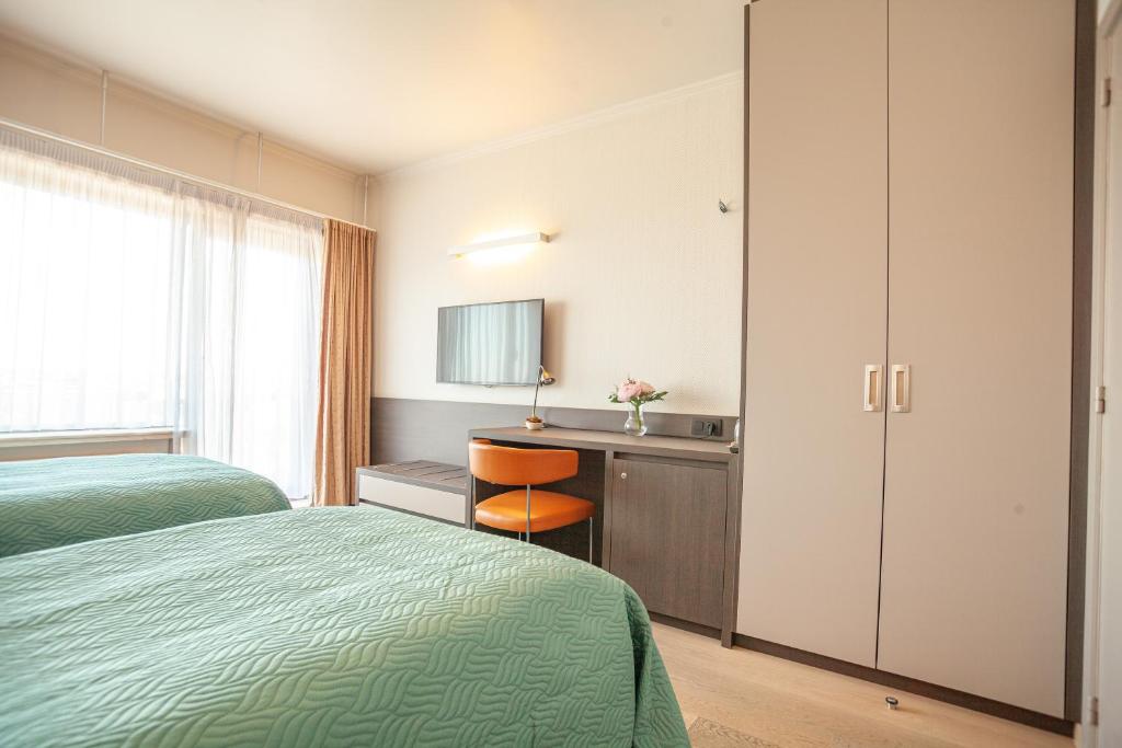 Postel nebo postele na pokoji v ubytování Hotel Monaco Zeebrugge Beach by Rikas Hotels