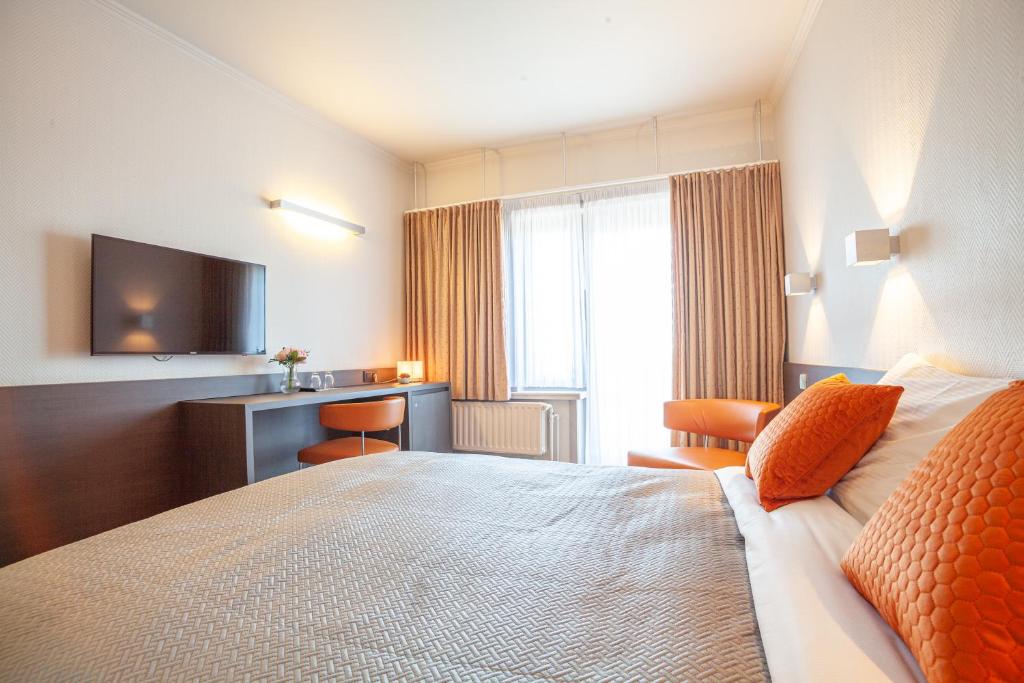 Postel nebo postele na pokoji v ubytování Hotel Monaco Zeebrugge Beach by Rikas Hotels